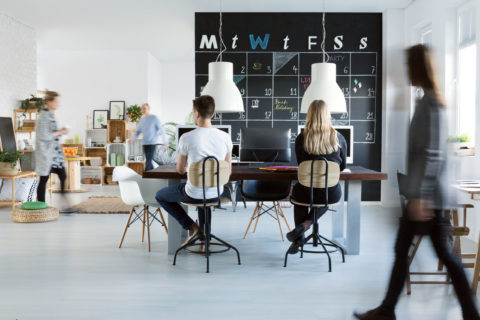 Young people working in trendy friendly office
