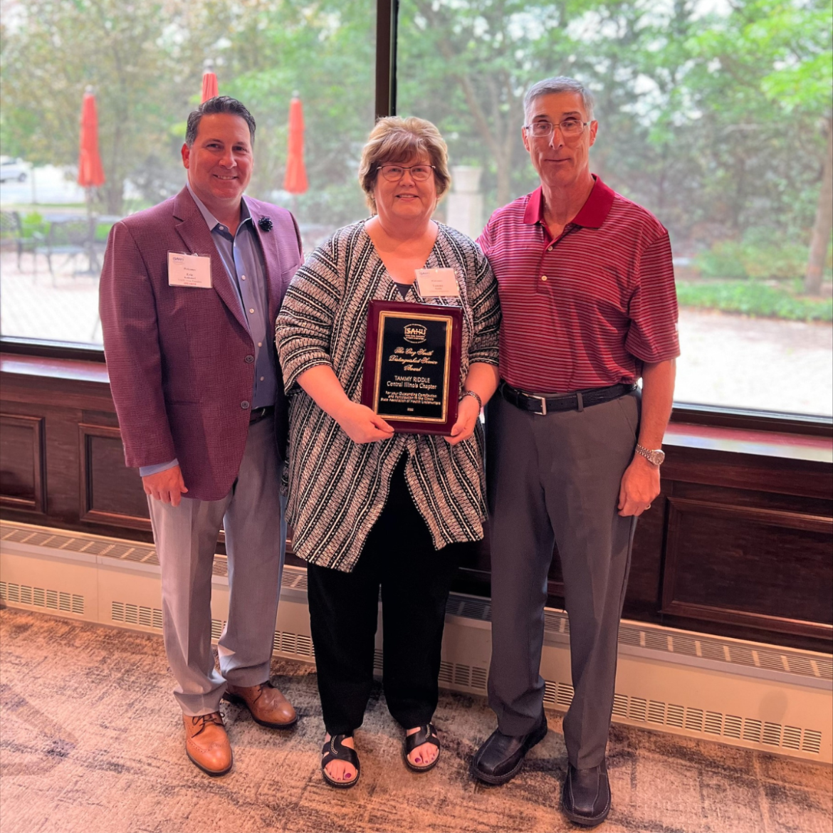 Tammy Riddle with award